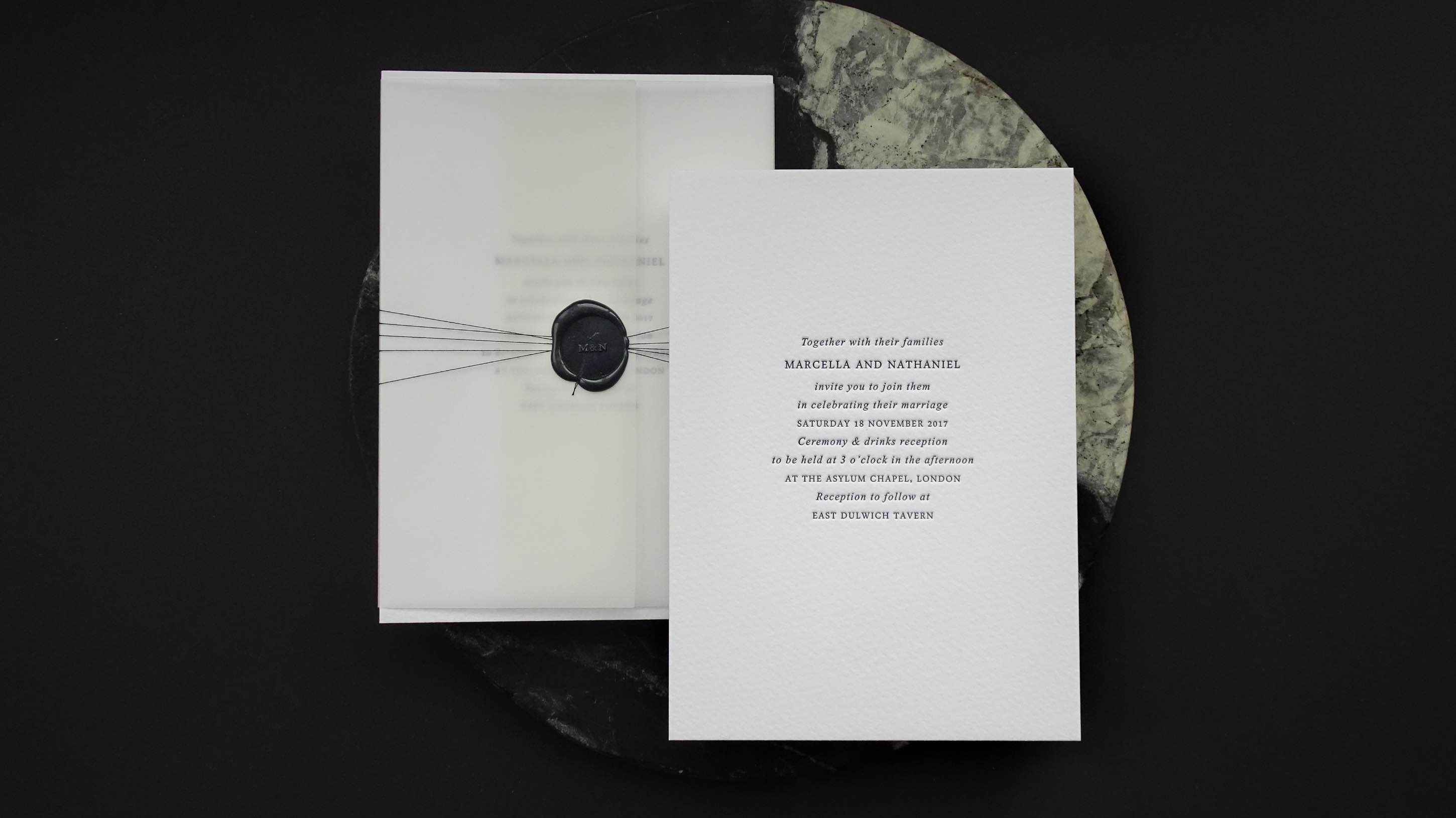 Wax seal and vellum wrap on a letterpress wedding invitation
